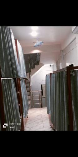 a room with green curtains in a room at Sg hotel in Bhopal