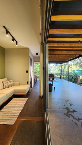a living room with a couch and a piano at SPA BOA VISTA - Refugio in Itatiba