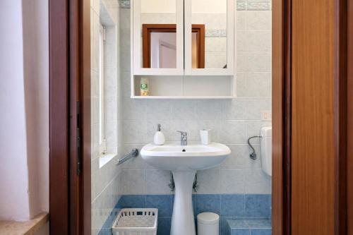a bathroom with a sink and a toilet at La casa di Sally - Silenzioso Bilocale in centro in Trieste