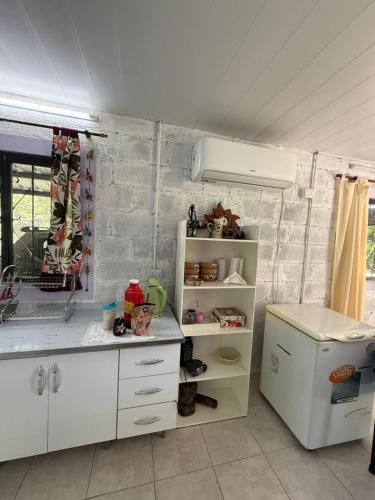 a kitchen with white cabinets and a counter top at Aurora in Santiago del Estero