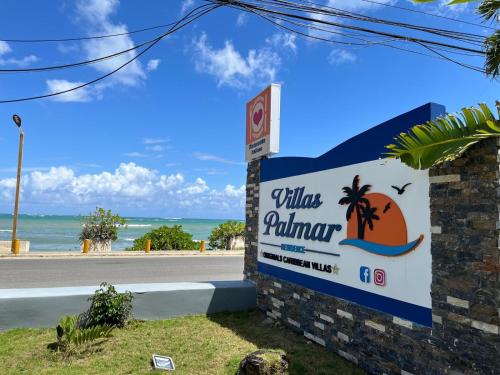 a sign for a villas panama on the side of a road at Villas Palmar Residence Beachfront Villas & Studios in Las Terrenas