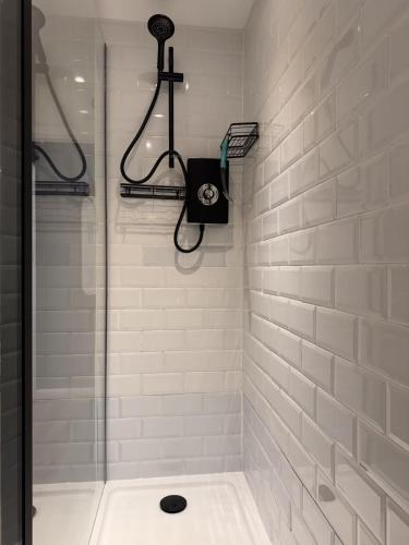 a bathroom with a shower with a shower at The Lazy Fox, Shrewsbury in Shrewsbury