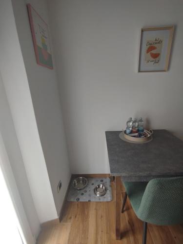 a room with a table and a drain in the floor at Bilocale Home Project 2 in Novara