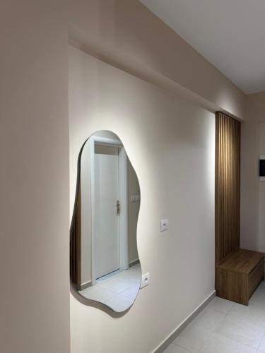 a mirror on the wall in a hallway at Vila Llaman Luxury Rooms in Himare