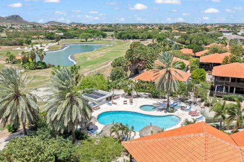 an aerial view of the resort with a pool and golf course at Luxury Villas with Panoramic View in Blue Bay in Blue Bay