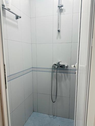 a bathroom with a shower with a glass door at martIN Apartment 2 in Bansko