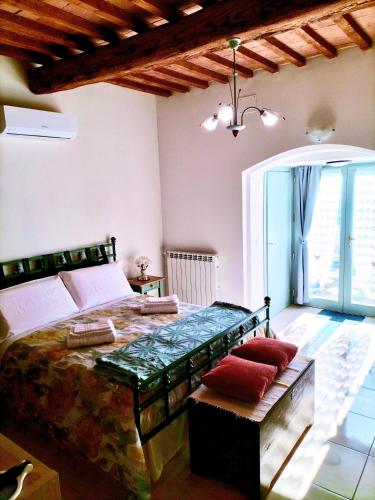 a bedroom with a large bed and a window at Il Colle in Treggiaia