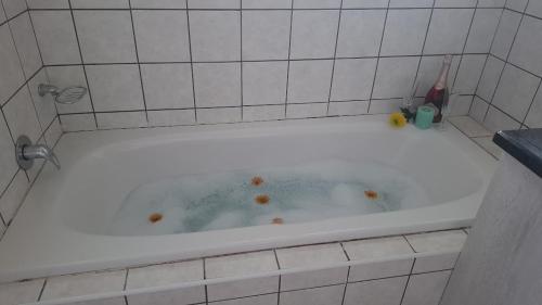 a bath tub filled with water with rustedustedustedustedustedustedustedusted at AVillaT15SelborneGolfEstatePennington in Pennington
