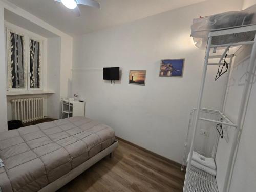 a bedroom with a bed and a ladder in it at Danito Rooms 3 singola in Ancona
