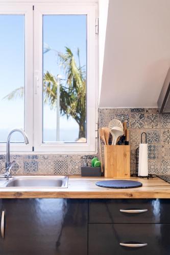 a kitchen with a sink and a window at Casa das Eiras, Nº48 in Santana