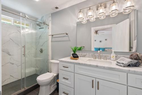 a bathroom with a shower and a toilet and a sink at Boots and Barrels Ranch in Paso Robles