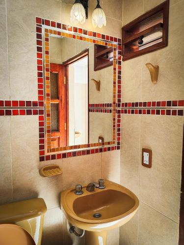 a bathroom with a sink and a mirror at Hostel Copacabana La Quiaca in La Quiaca