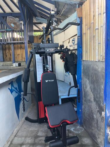 a gym with a camera in a building at Hostel Gili Trawangan - Max 2 Guest in 1 Room - with free GYM ! in Gili Trawangan