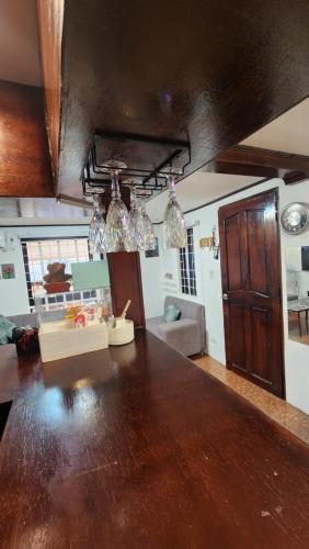 a living room with a large wooden counter top at Casa Minsorado in General Trias