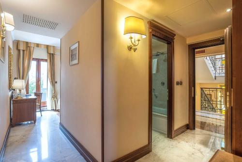 a hallway with a glass door in a house at Tmark Hotel Vaticano in Rome