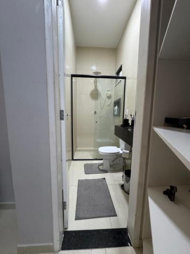 a bathroom with a shower and a toilet in it at Casa Belchior in Sobral