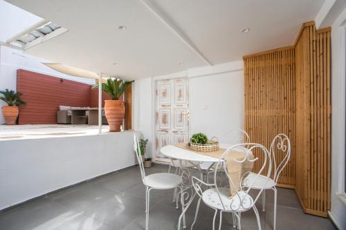 a dining room with a table and chairs at Iriada House in Rhodes Town