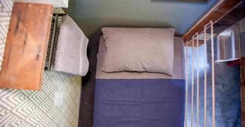 a small bedroom with a bed in a room at PodShare East Hollywood in Los Angeles