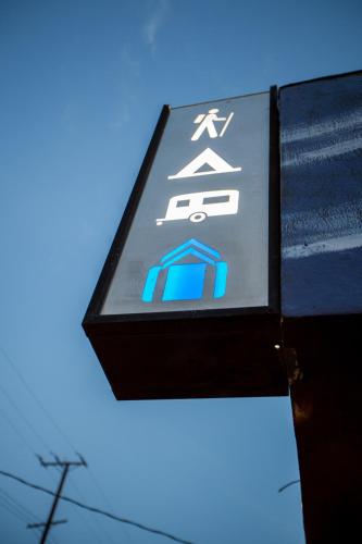 a sign on a building with a blue sky in the background at PodShare East Hollywood in Los Angeles