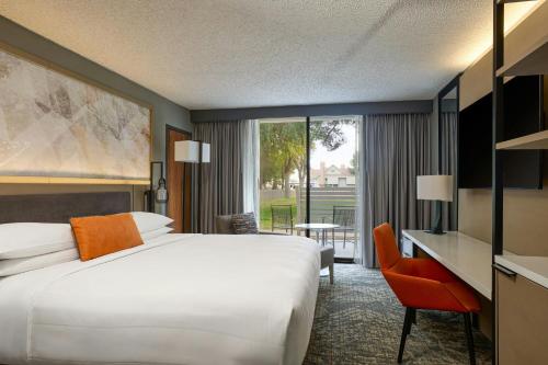 a hotel room with a large bed and a desk at Marriott El Paso in El Paso