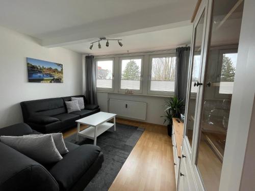a living room with a couch and a table at Fewo Haus Piepenbreier in Bad Sassendorf