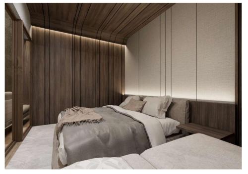 a bedroom with two beds and a couch at The Foresta By Ohana in Timuran