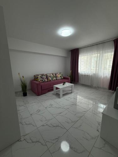 a living room with a couch and a table at Anastasia in Mangalia