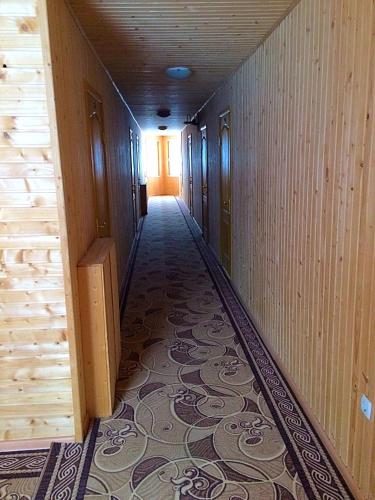 an empty hallway with a tile floor in a building at Dream House in Yablunytsya