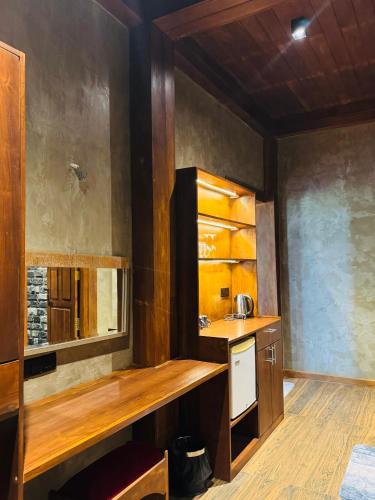 a kitchen with a counter and a sink at Aria Resort in Sigiriya