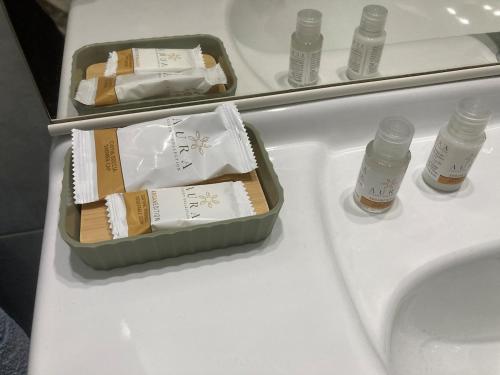 a container of food sitting on a table next to a sink at Da Li Al Mar in Savona