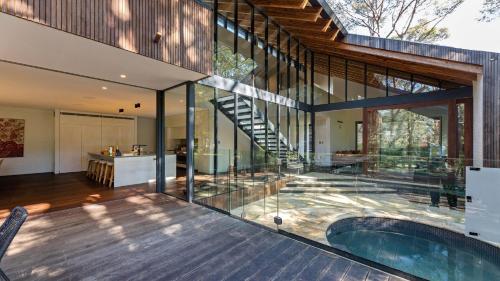 an external view of a house with a swimming pool at Architectual Design, Plunge Pool, Lagoon Frontage in Pearl Beach
