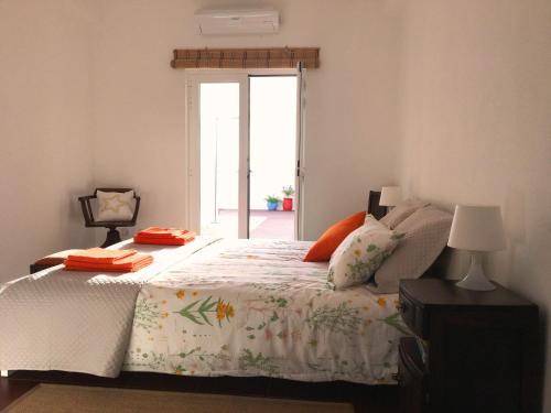 Кровать или кровати в номере Casa Encosta da Lagoa