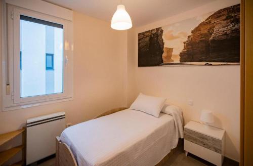 En eller flere senge i et værelse på Area Suites