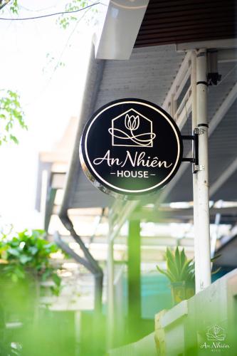 a sign for an am kitchen house on a pole at An Nhiên House in Kon Rung (1)
