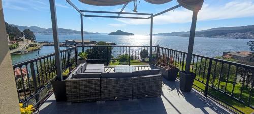 a balcony with a view of the water at Mirador de Tambo - Campelo in Poio