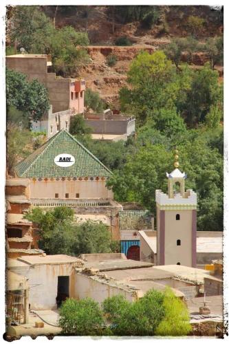 a group of buildings with a church and a tower at Sidi hssain in Marrakesh