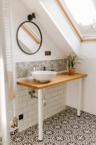 a bathroom with a sink and a mirror at Ta Chalupa in Prostřední Bečva