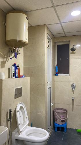 a bathroom with a toilet and a sink at The Horizon House in Zirakpur