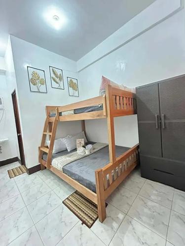 a bedroom with two bunk beds in a room at Dodong homestay 2 in General Luna