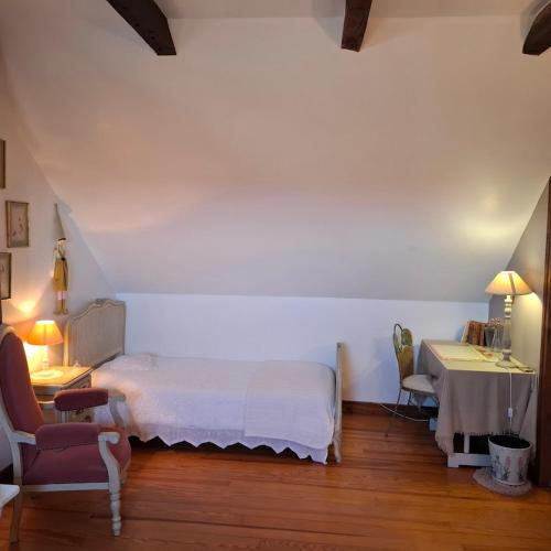 Llit o llits en una habitació de Chez Marraine