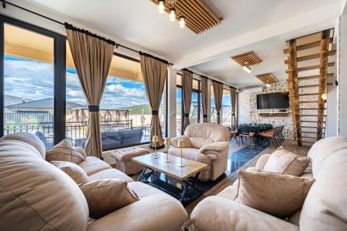 a living room with couches and a table at VILA K3 Podgorica in Podgorica