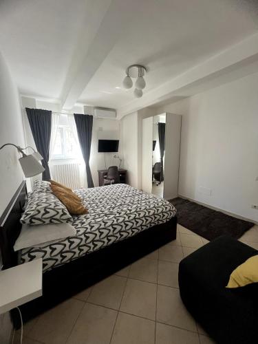 a bedroom with a large bed and a window at Casa Paoli in Salerno