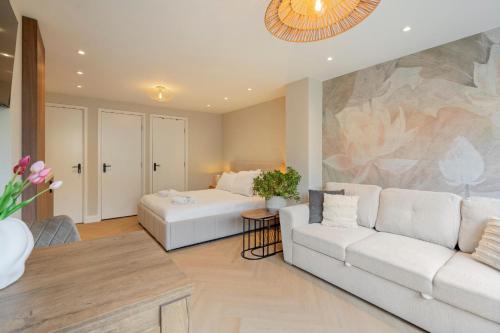 a living room with a couch and a table at Boetiek ManjaFiek in Zandvoort