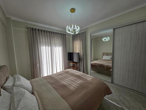 a bedroom with a bed and a large mirror at Flogita Dream in Flogita