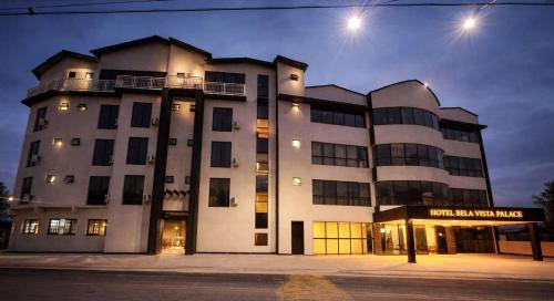 a large building on a street at night at Hotel Bela Vista Palace in Araçariguama