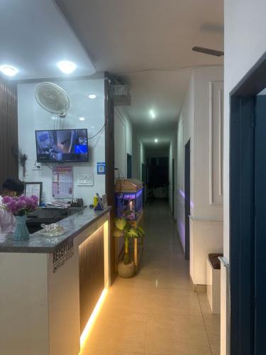 a room with a hallway with a fish tank on a counter at Hotel park view in Bathinda