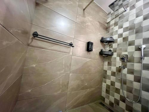a shower with a glass door in a bathroom at StarLux Residence - Because you deserve it! in Ćuprija