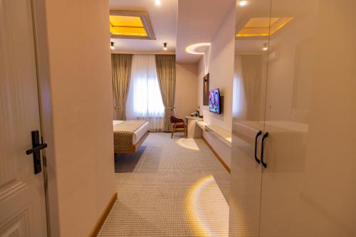 a corridor of a hotel room with a bedroom at National Hotel Ganja in Ganja
