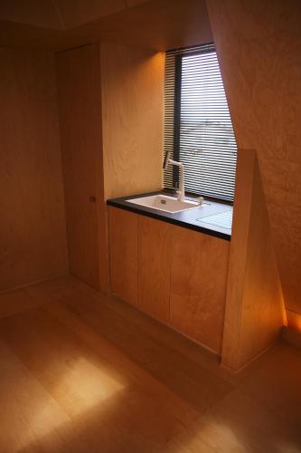 a small kitchen with a sink and a window at Kokage Villa Nikko-KVN in Nikko