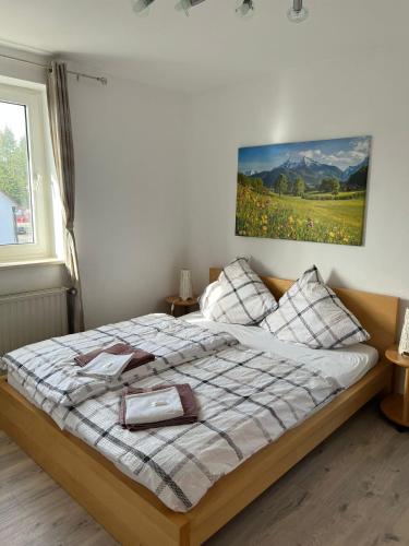 a bedroom with a bed with a picture on the wall at Caldener Hof in Calden